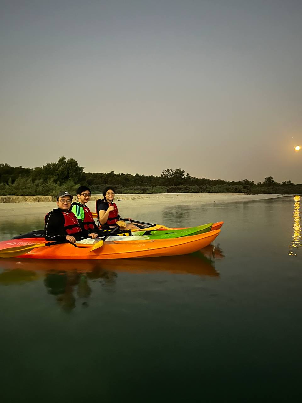 Kayaking during the sunrise with scholarly friends from Singapore. The water is clear and calm. Photo taken by our wonderful guide Joseph.